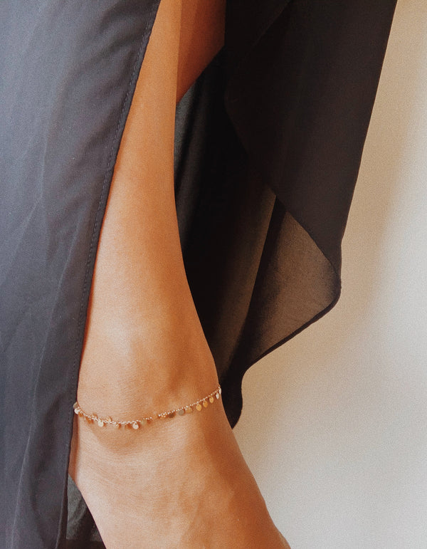 Rose Gold anklet with gold discs.