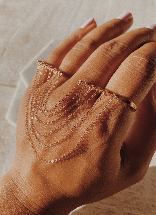 Thick palm cuff: Rose gold palm cuff with chains.
