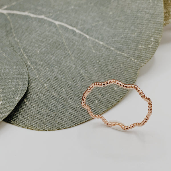 Wave rose gold ring either smooth or braided texture. 