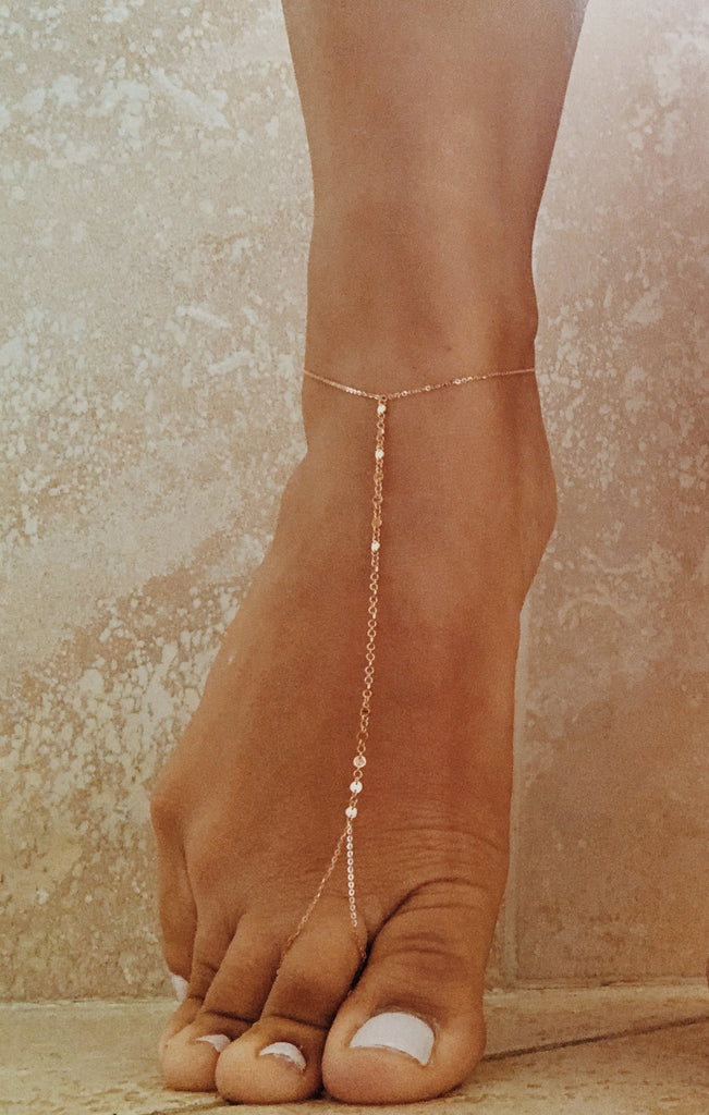 Rose gold foot jewellery with gold accent discs to be worn on the foot. 