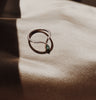 Rose gold midi ring with a pear shaped emerald gem.