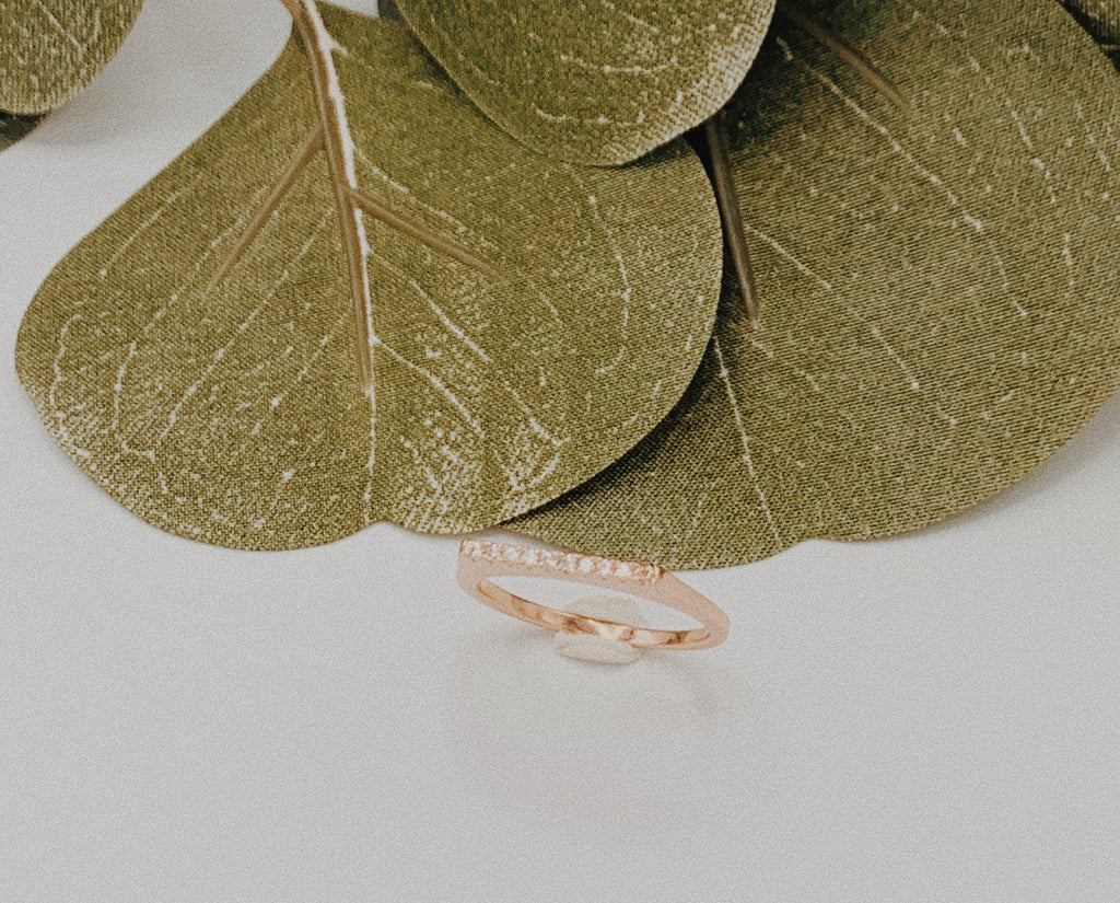 Rose gold ring with ten cubic zirconias.
