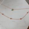 Two-layer rose gold chain anklet with emerald and pink morganite gemstones.