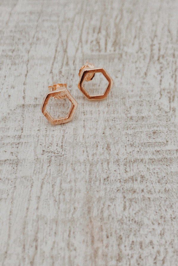 Rose gold polygon earrings.